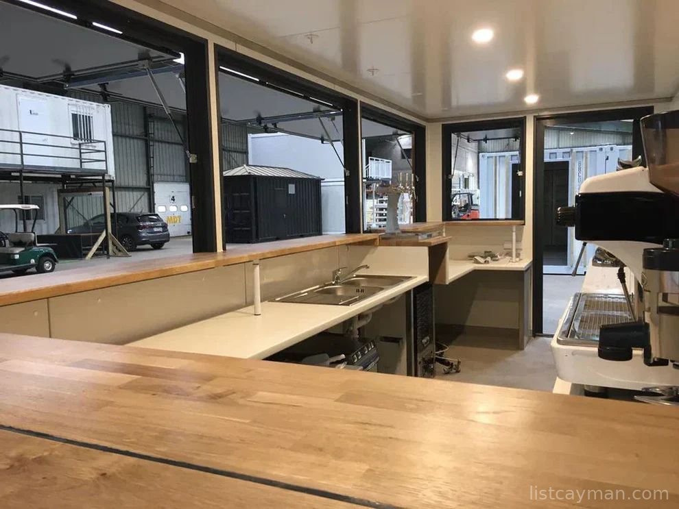 A 6-meter (20-foot) shipping container housing a cafe, with a very minimalist design photo 5